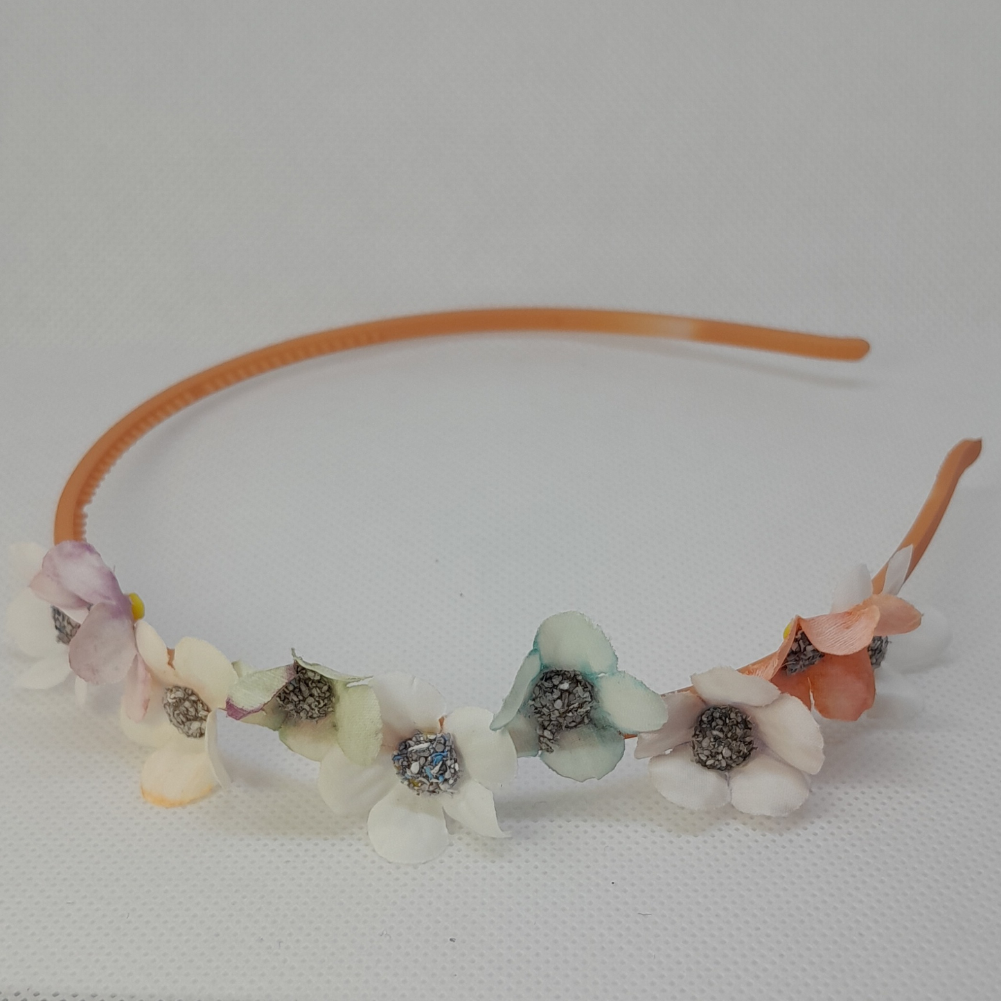 Boutique Pastel Headband for Girls – Partially Adorned with Delicate Artificial Flowers on a Sleek Plastic Band