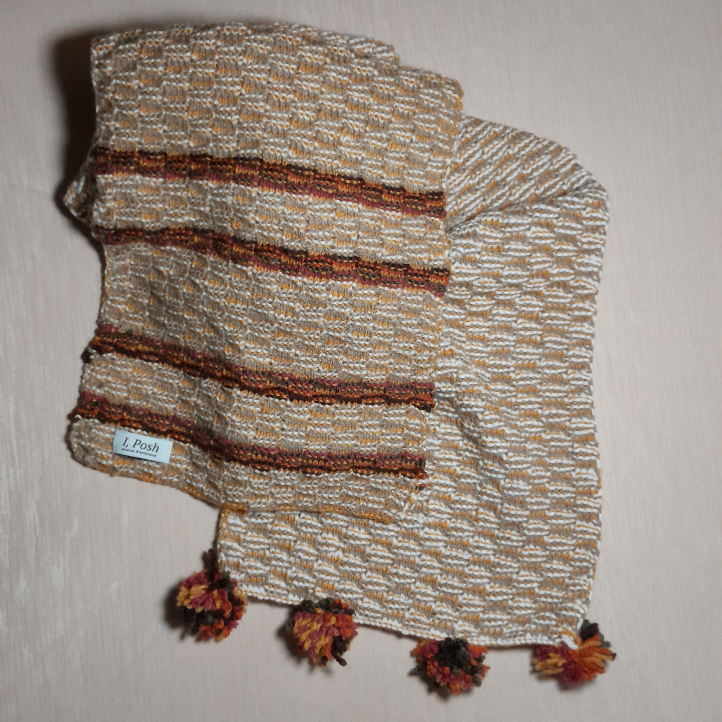 Earth-Toned Wool Scarf for Women – Asymmetrical Grace with a Pom Pom Caress and Radiant Brown Rays